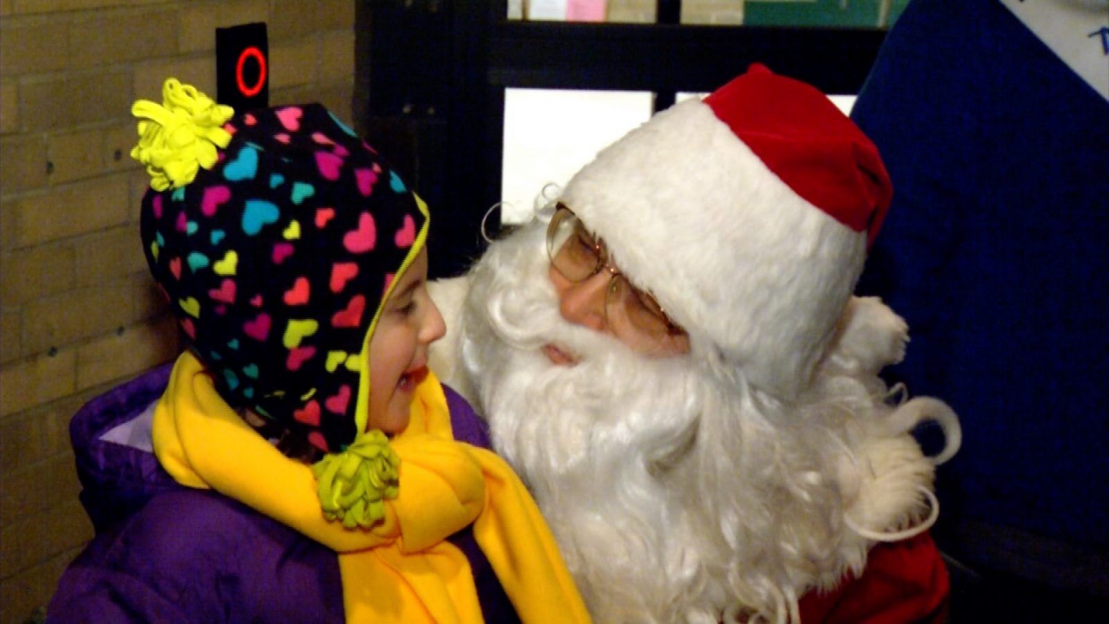 Santa visiting with a child