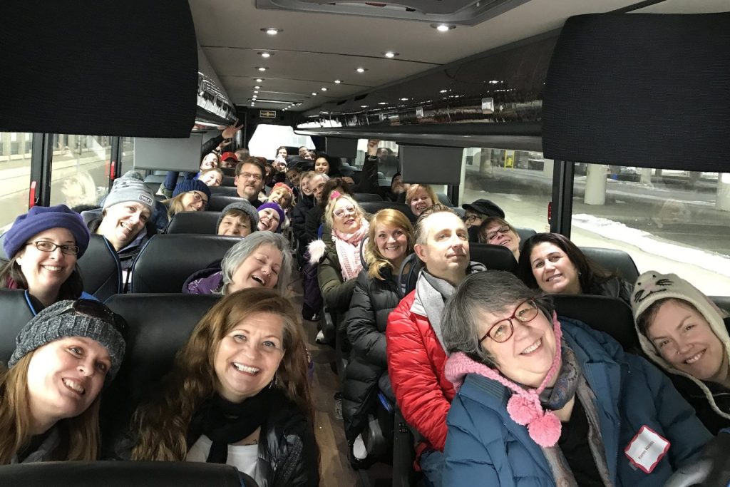 Volunteers on the bus headed to scarf bombing.