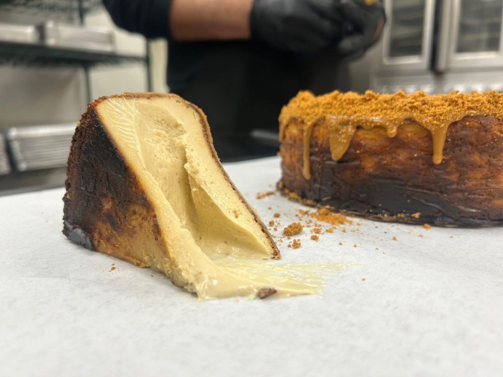 slice of creme cheesecake sitting on a counter