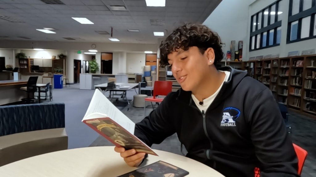 student reading bakke shakespeare translation book 