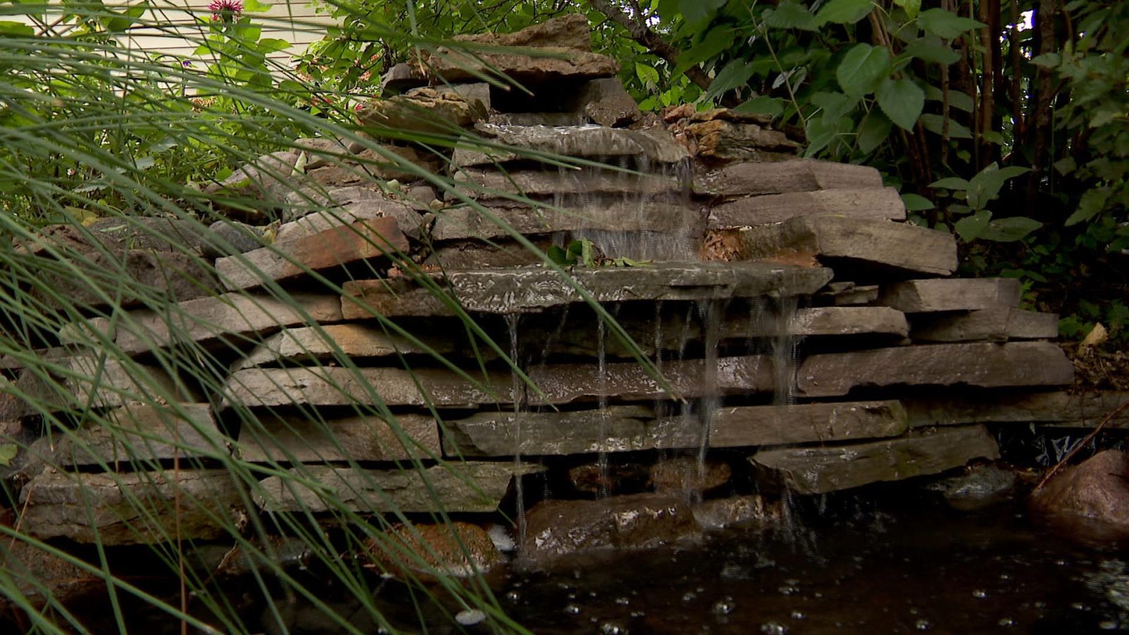 A homemade water fall in a garden in Crystal.