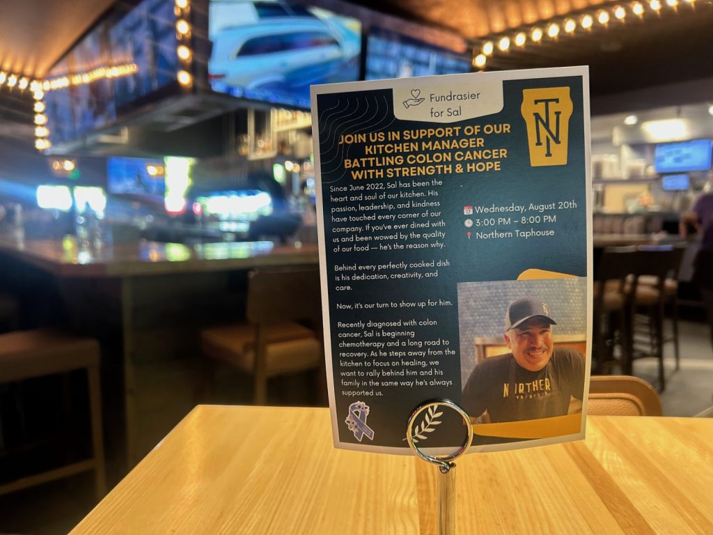 flyer sitting on a tape in a northern taphouse restaurant