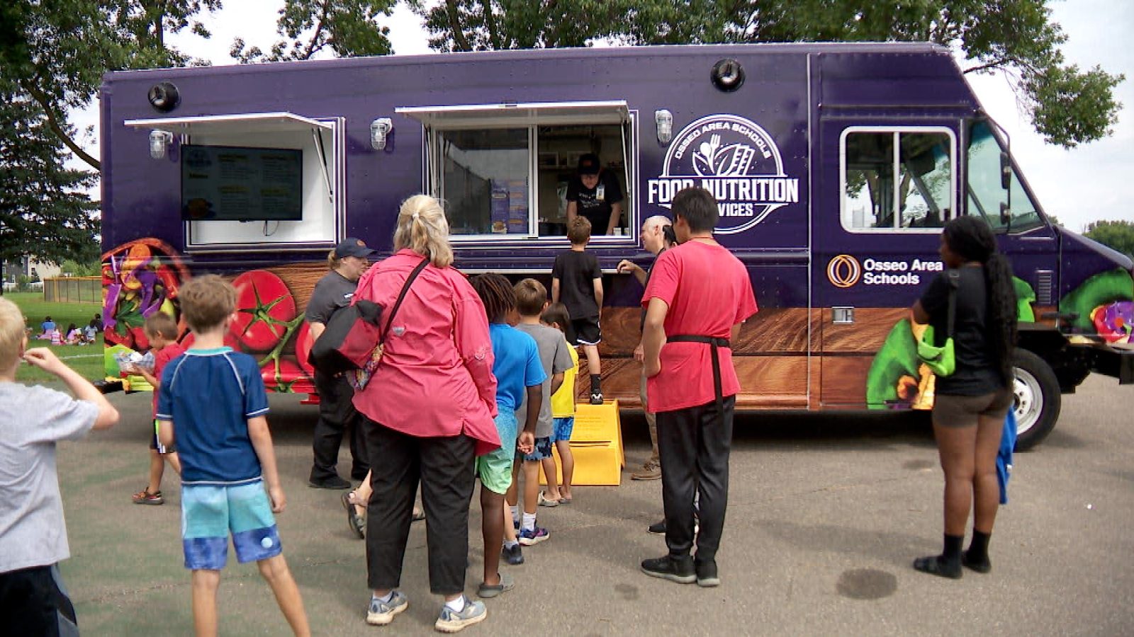 line outside of Osseo Nutrition Services free food truck