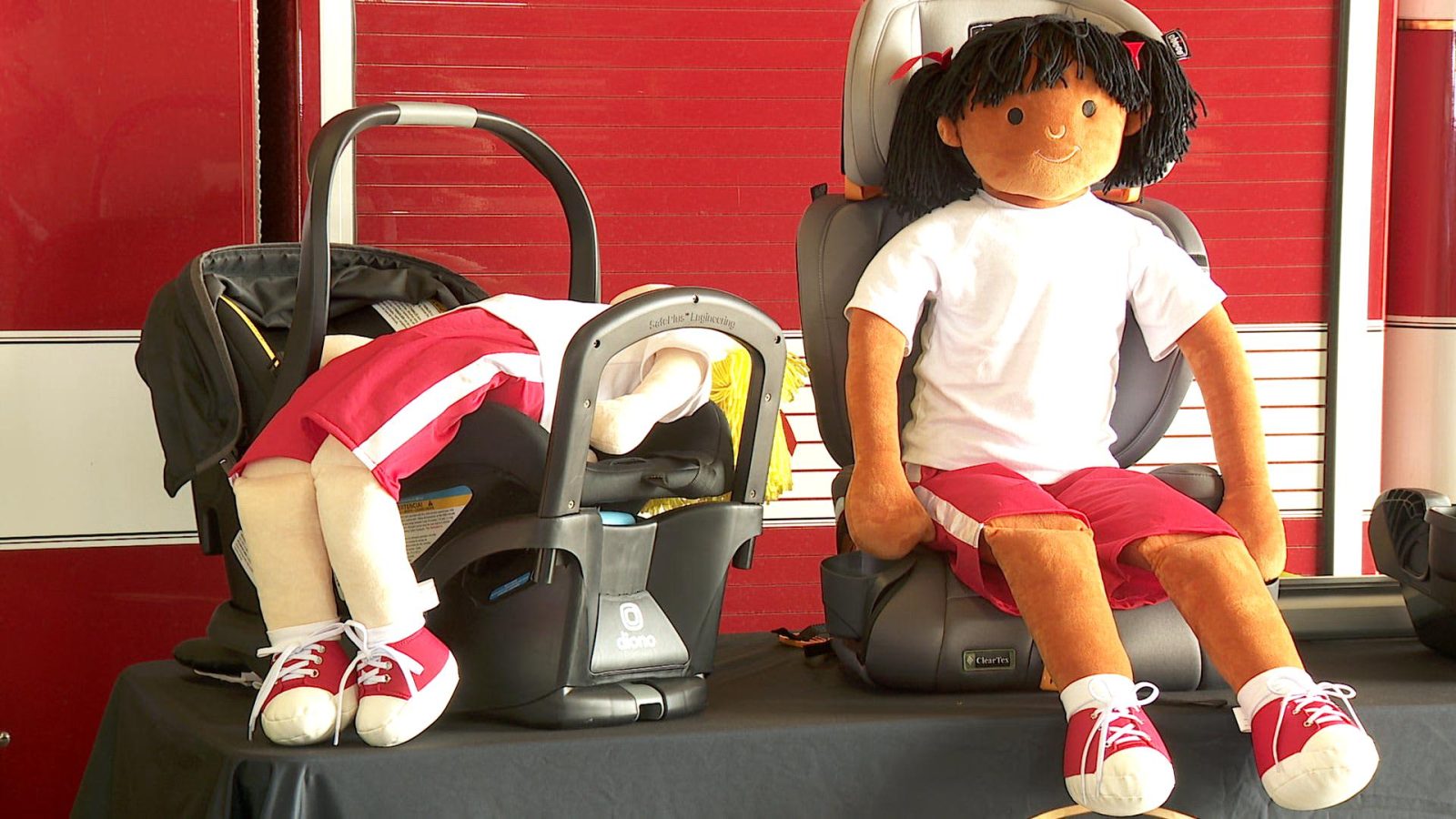 dolls in a car seat