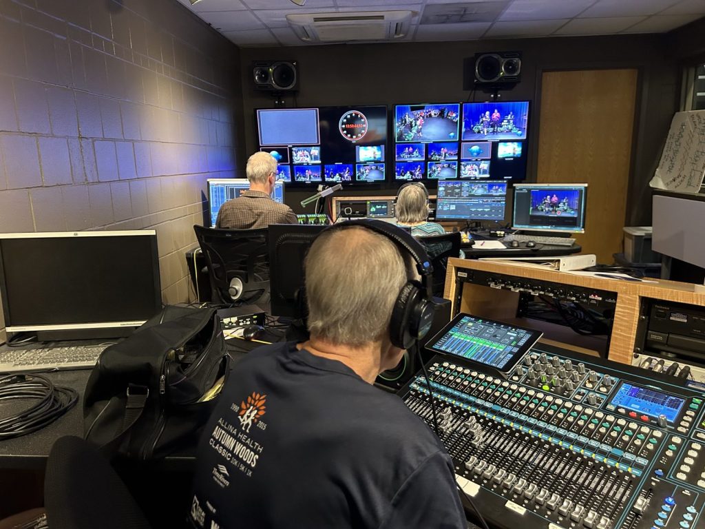 Studio control room with monitors and keyboards