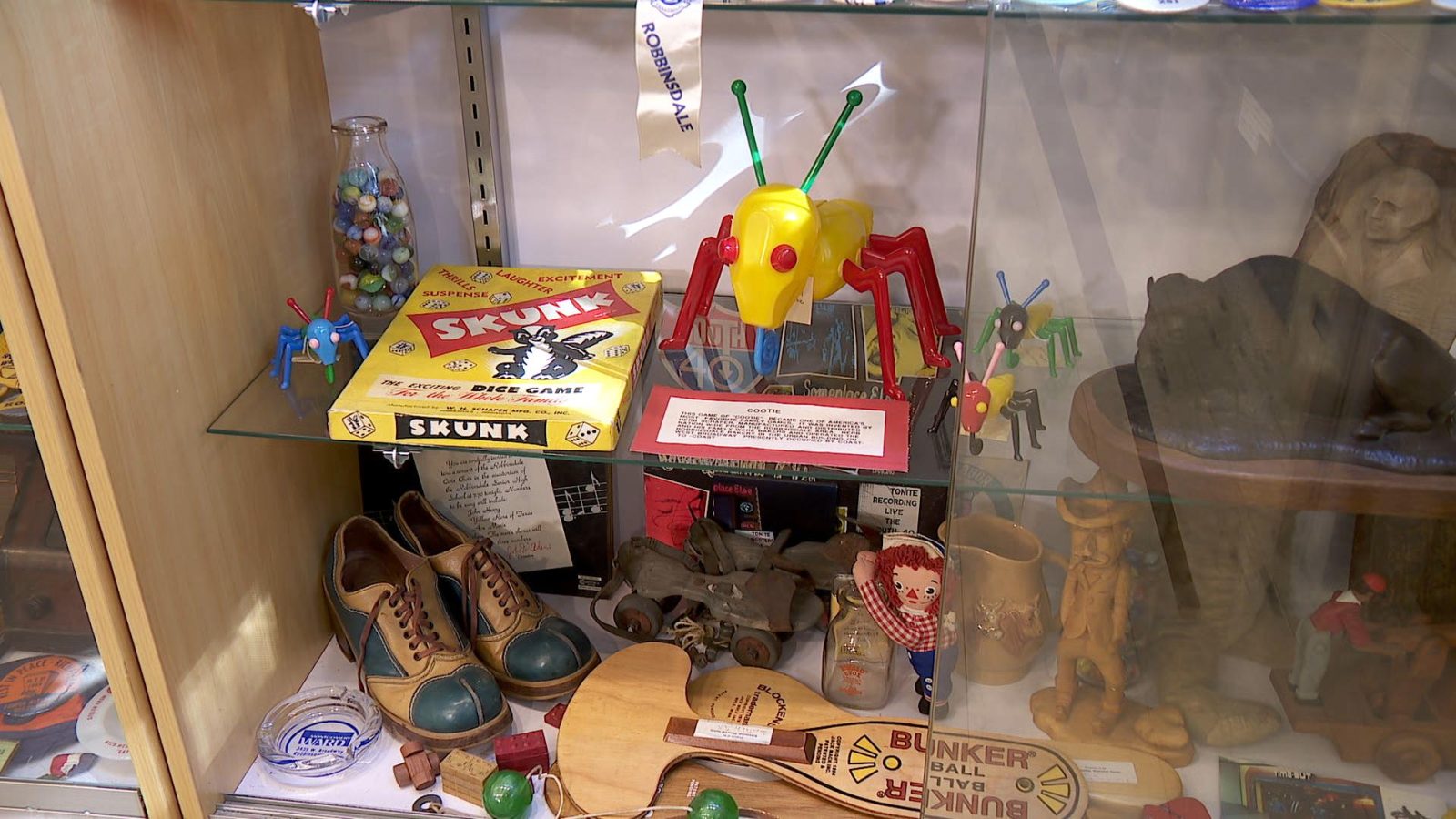 image showing a cootie toy in a display case
