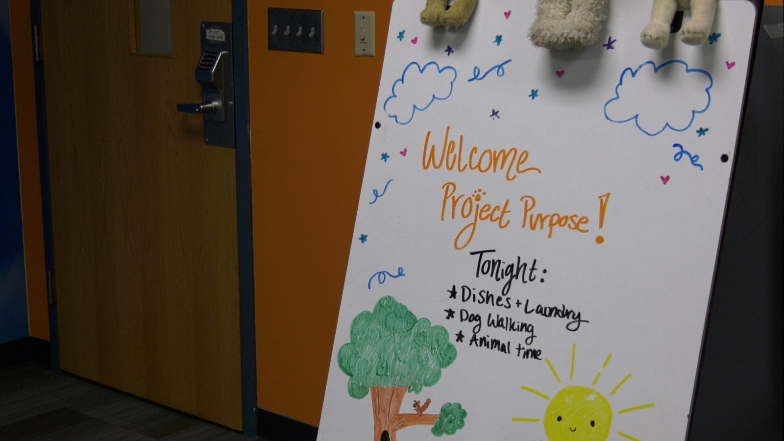 Whiteboard with welcome message for Project Purpose attendees