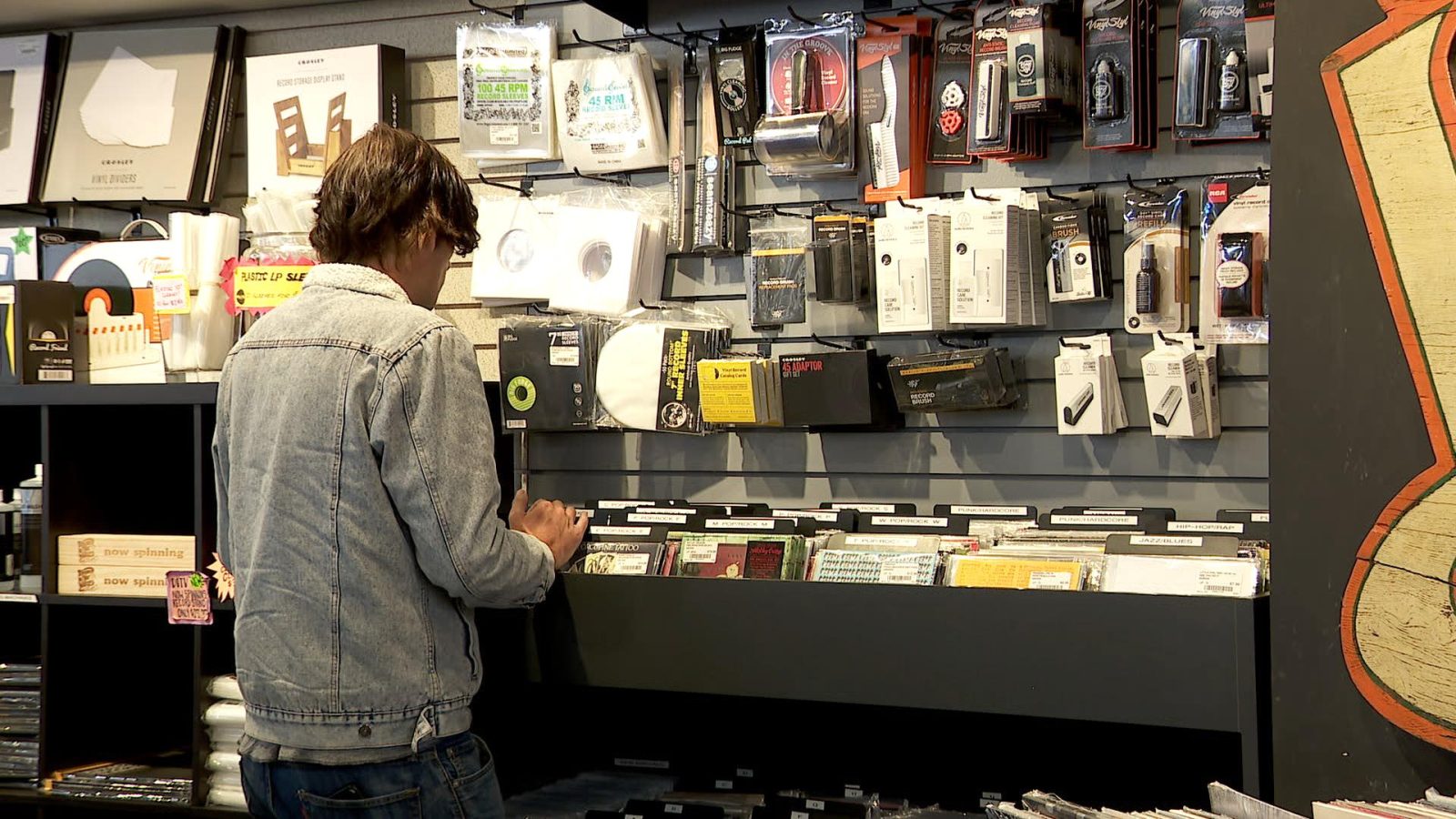 man shopping for records