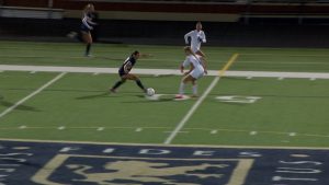 Maddyn Greenway attacks with the ball for Providence Academy girls soccer against Heritage Christian Academy