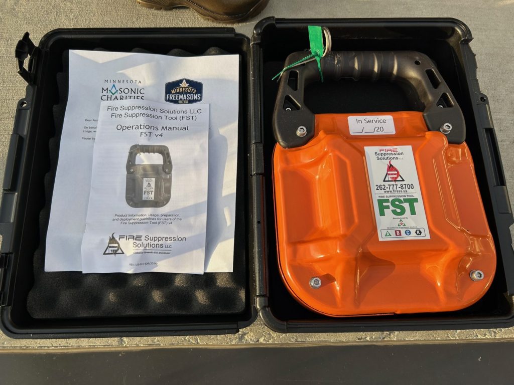 fire suppression tool sitting in a case