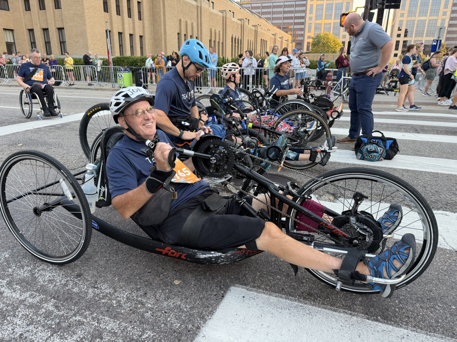 athlete on a lay-down hand cycle bike