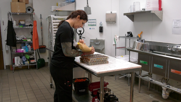 chocolatier denny rain producing chocolate at cocoa flake