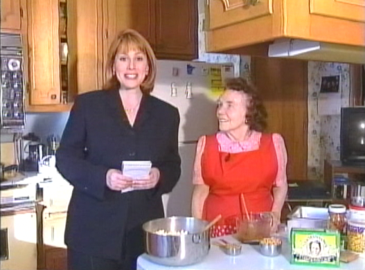 two women in a kitchen getting ready to bake