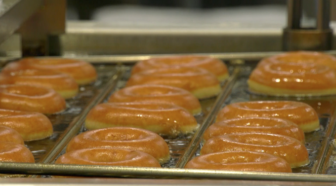 krispy kreme doughnuts being fried