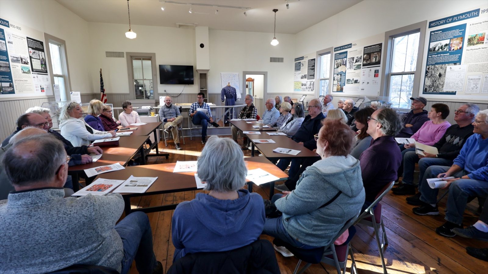 Group of people around a discussion table 