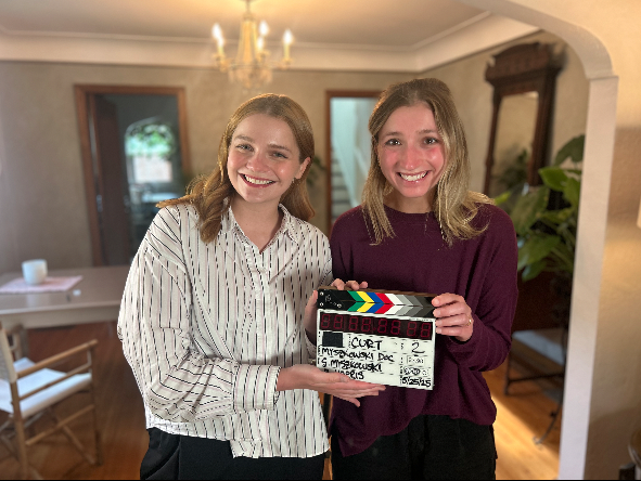 sophia and olivia Myszkowski holding up a clapperboard