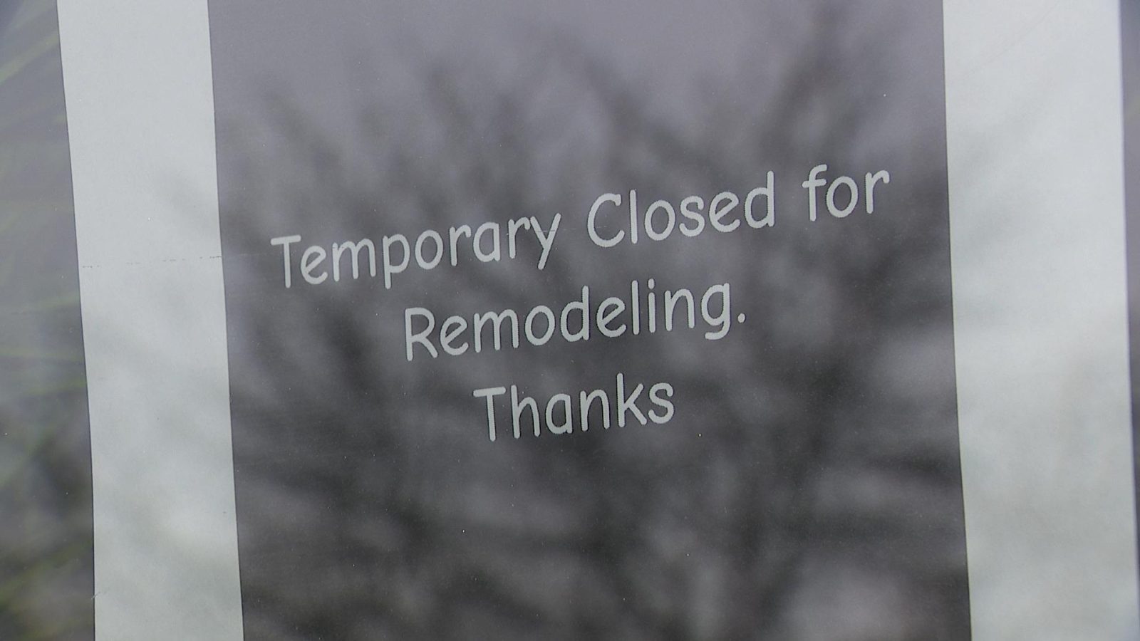 sign in a window at the crumbs and coffee restaurant