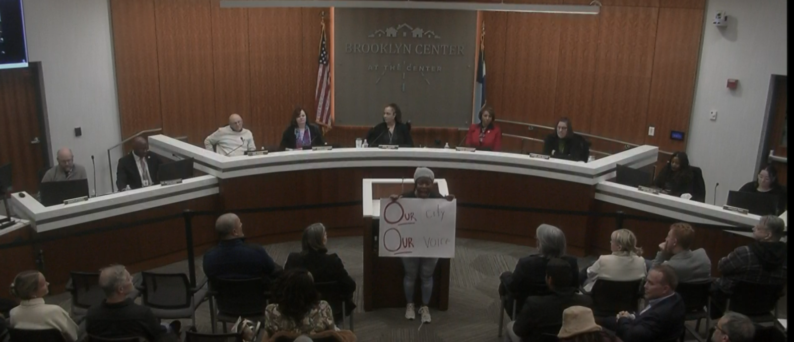 protestor holds a sign
