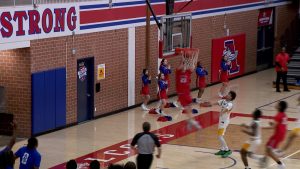 Javaun Watson dunks for Armstrong boys basketball in the Falcons 81-74 win over Park Center