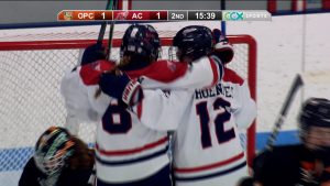 Armstrong-Cooper girls hockey celebrates a goal