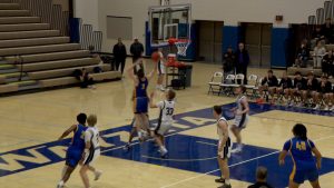 Nolen Anderson goes up for a basket for the Wayzata boys basketball team in the Trojans' win over Buffalo.