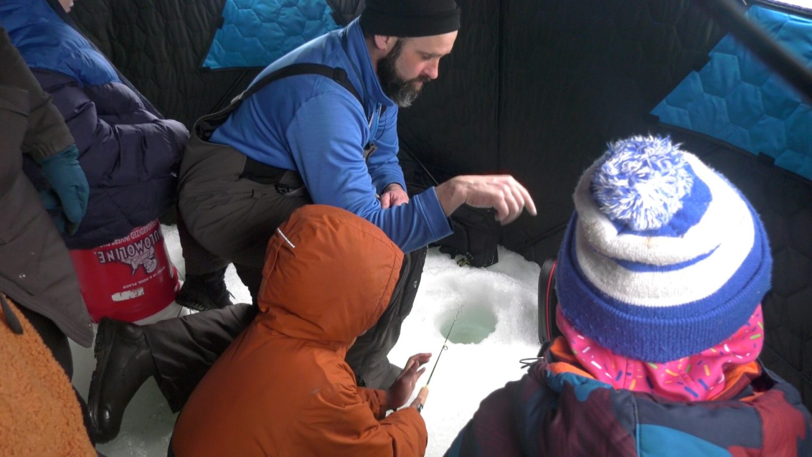 teacher in an ice house with children