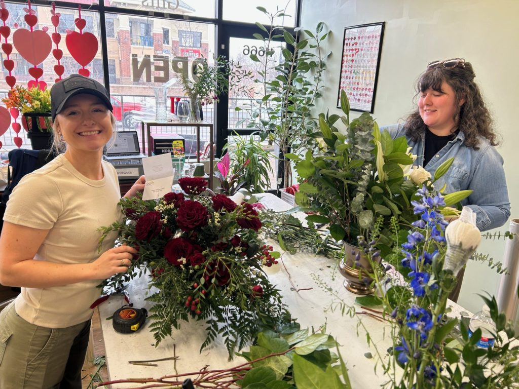 two women put together floral arrangements at Styled Stems flower shop