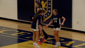Providence Academy girls basketball celebrates a basket in their win over Monticello