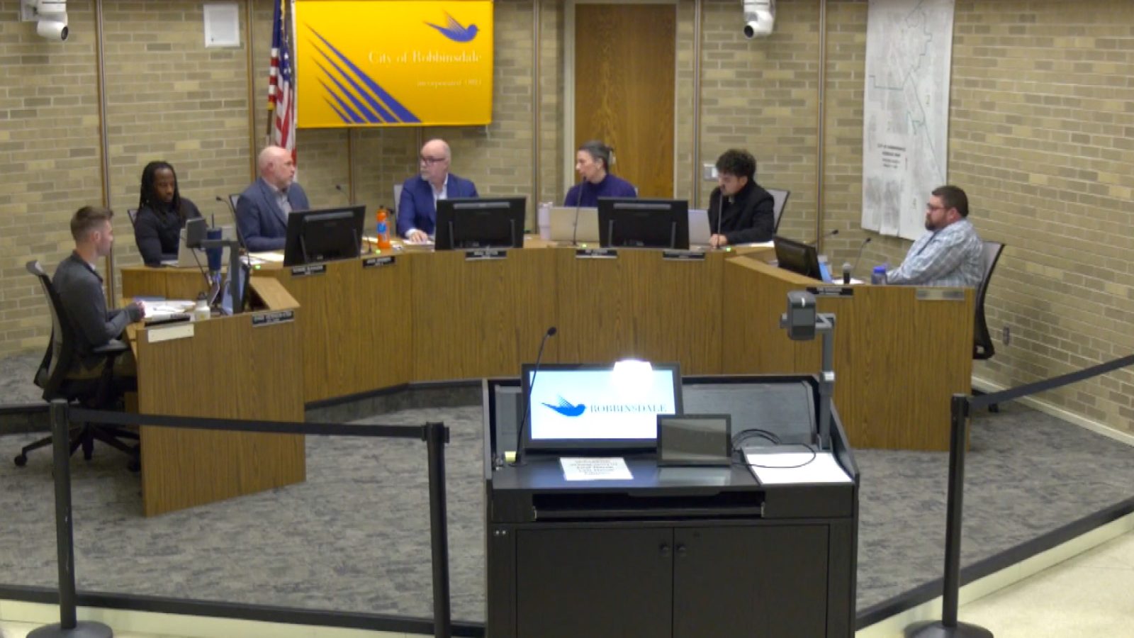 members of Robbinsdale City Council seated around the dais at a recent meeting