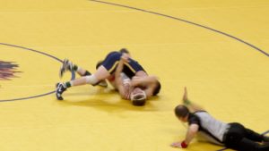 Jackson Refsnider of Totino-Grace pins his opponent in the state final