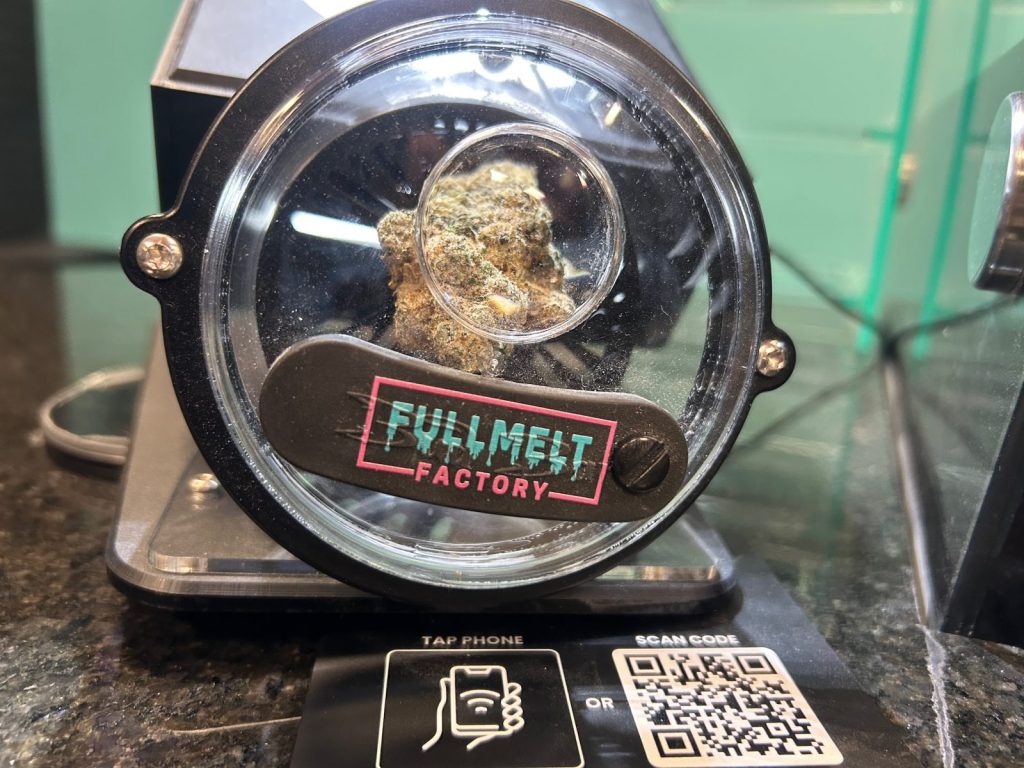 cannabis flower in a container with a label that says "fullmelt factory"