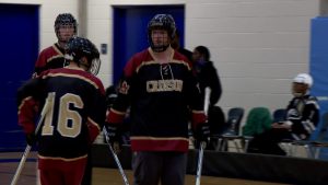 Maple Grove PI Adapted floor hockey team celebrates a goal versus Minneapolis on February 27, 2026