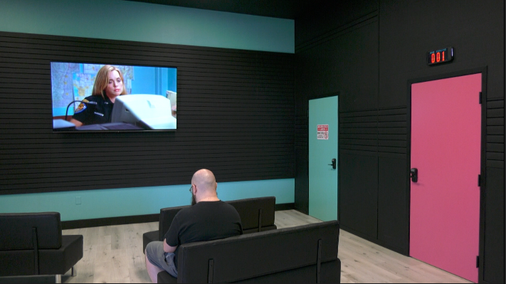 waiting area with a TV hanging on the wall at fullmelt factory in maple grove