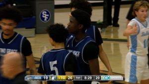 Totino-Grace boys basketball celebrates a made basket