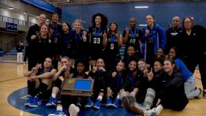 Hopkins girls basketball and their 2026 section championship trophy