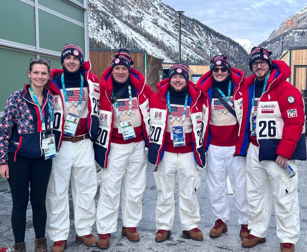 group standing in front of mountain in italy