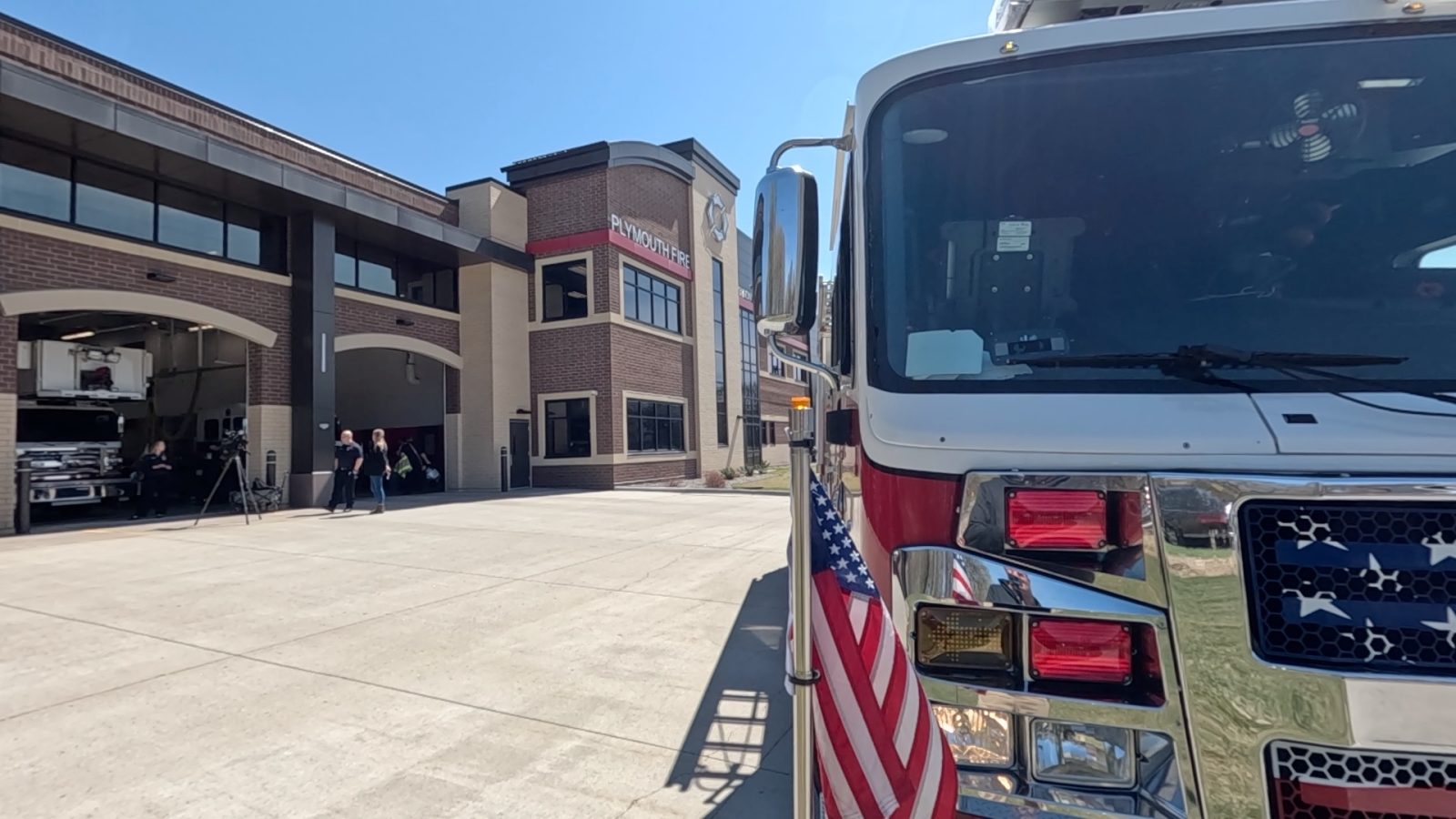 a fire engine parked outside a fire station