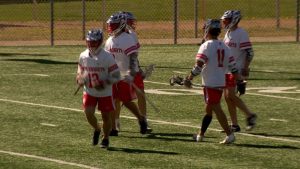 Benilde-St. Margaret's boys lacrosse team celebrates a goal