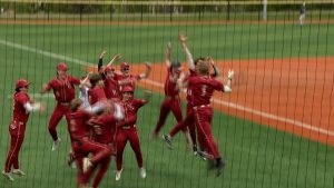 Maple Grove baseball celebrates Beckett Shimpa's homerun versus Champlin Park