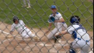 West Lutheran baseball player slide home