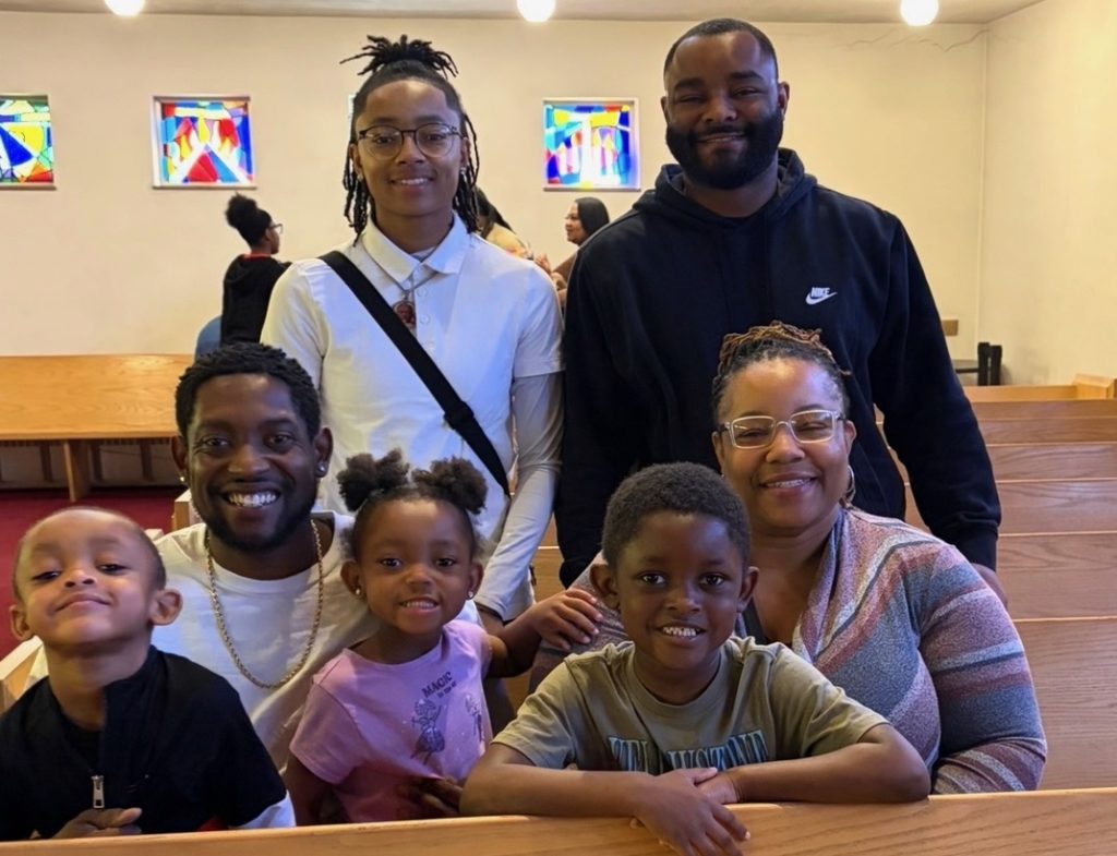 family gathered in a church
