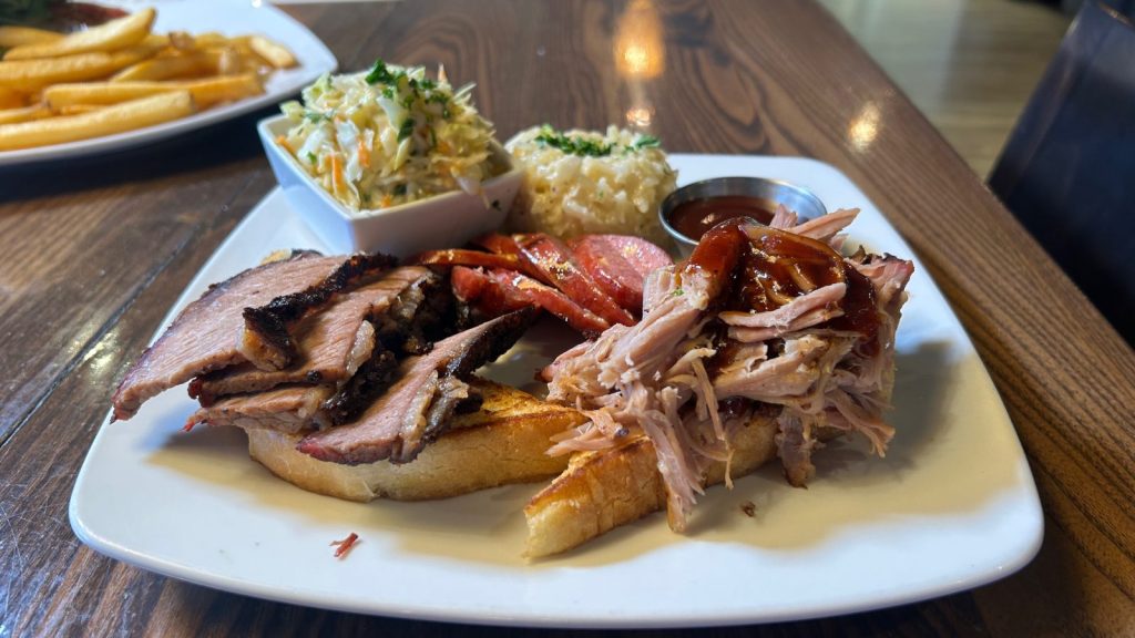 a plate of barbecued brisket and pulled pork at rock elm revival restaurant in plymouth 
