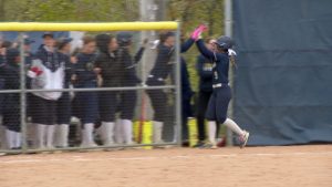 Providence Academy Softball celebrates a run against Breck