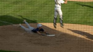Rhys George sliding in with a run versus Mounds View