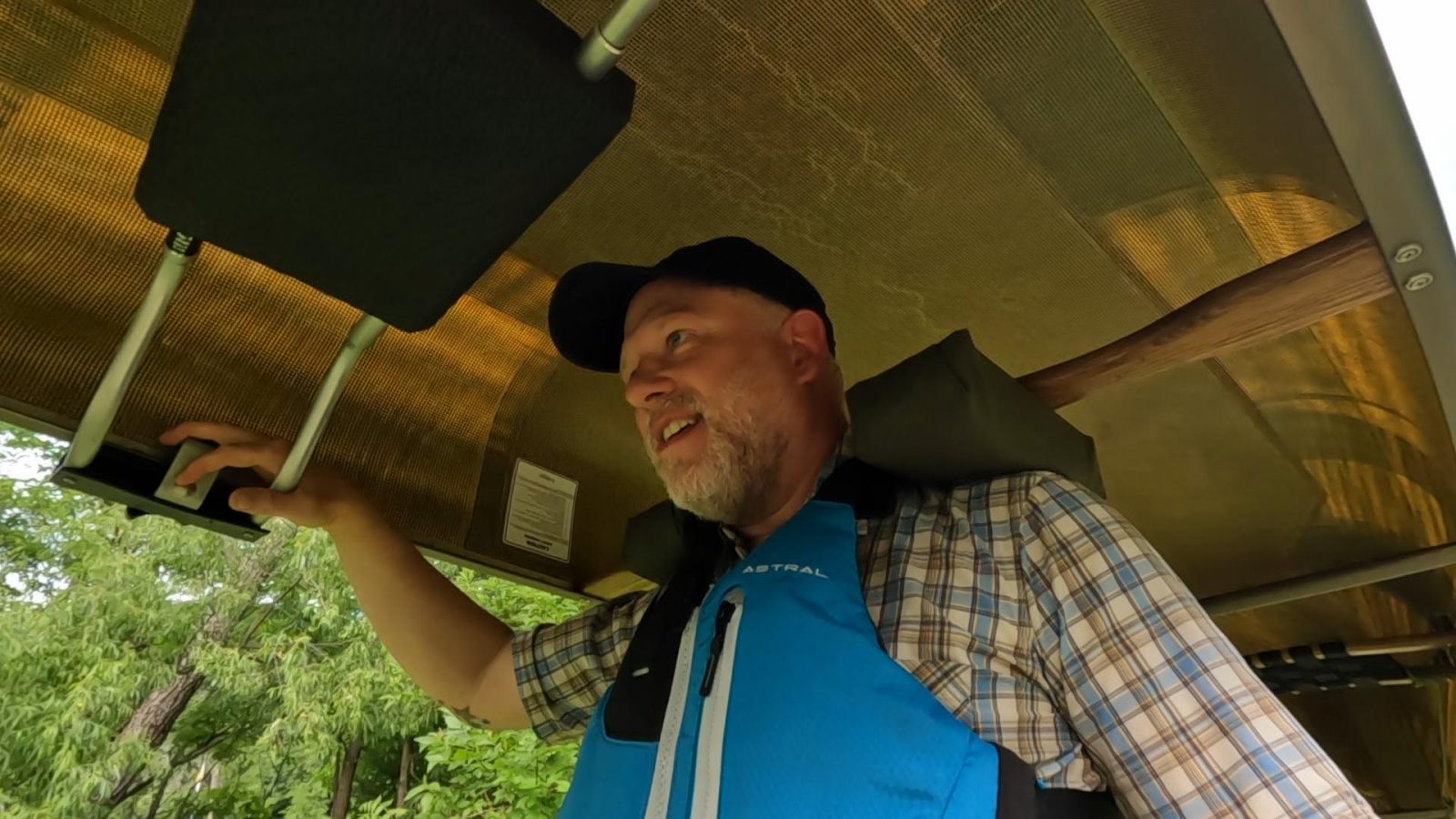 Tyler Sassaman carries a canoe