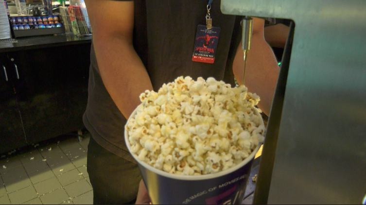 popcorn being buttered at willow creek movie theater